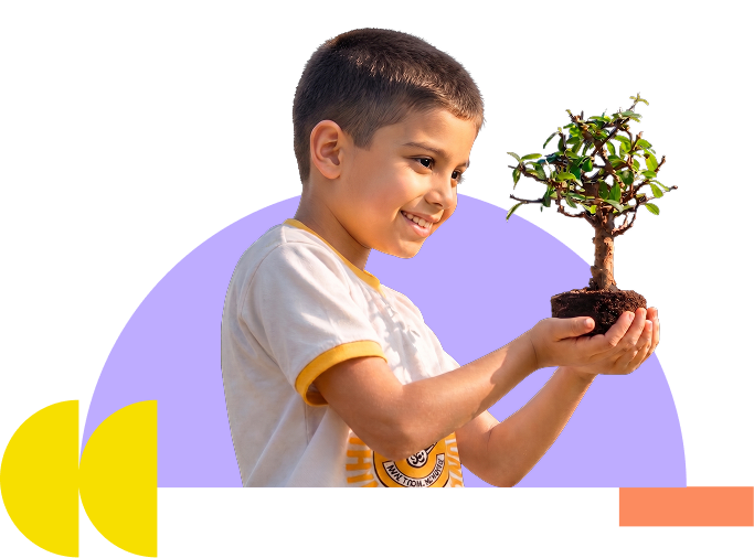 student holding plant