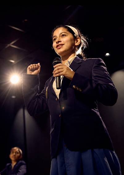 student holding mic